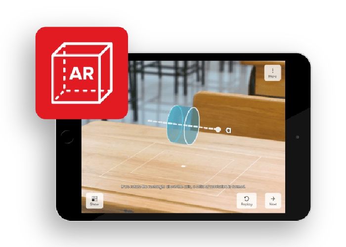 A tablet shows an image of a classroom with an AR-generated 3D shape hovering over a desk