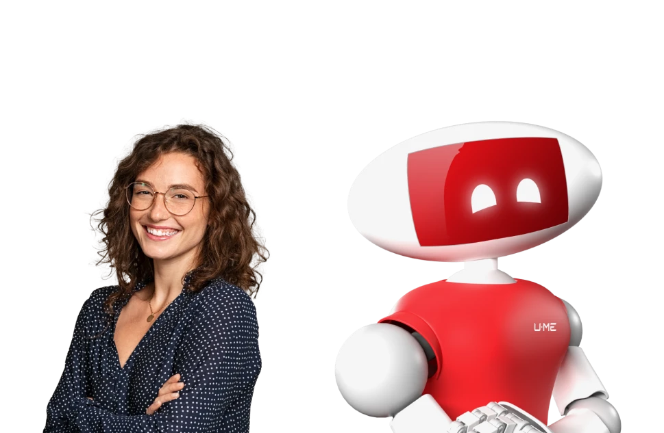Student smiling next to First Aid Forward robot